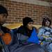 Customers T'ontaye Jones, 14, Jesse Morris, 15, and Jackie Berg wait in line for Black Friday deals outside Best Buy late Wednesday night. They were the first in line at 2:00 p.m. Daniel Brenner I AnnArbor.com
